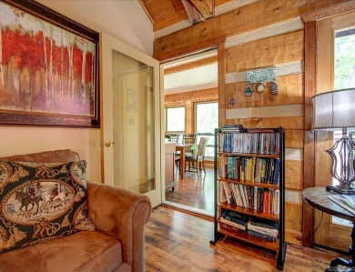Discover your peaceful forest retreat in this inviting 3-bedroom on Cortez Golf Course in Arkansas - for sale on GolfHomes.com, golf home, golf lot