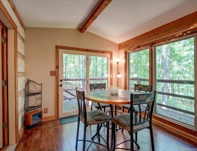 Discover your peaceful forest retreat in this inviting 3-bedroom on Cortez Golf Course in Arkansas - for sale on GolfHomes.com, golf home, golf lot