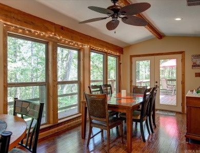 Discover your peaceful forest retreat in this inviting 3-bedroom on Cortez Golf Course in Arkansas - for sale on GolfHomes.com, golf home, golf lot