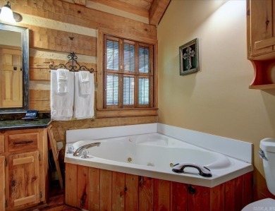 Discover your peaceful forest retreat in this inviting 3-bedroom on Cortez Golf Course in Arkansas - for sale on GolfHomes.com, golf home, golf lot