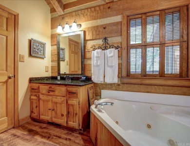 Discover your peaceful forest retreat in this inviting 3-bedroom on Cortez Golf Course in Arkansas - for sale on GolfHomes.com, golf home, golf lot