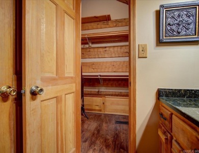 Discover your peaceful forest retreat in this inviting 3-bedroom on Cortez Golf Course in Arkansas - for sale on GolfHomes.com, golf home, golf lot