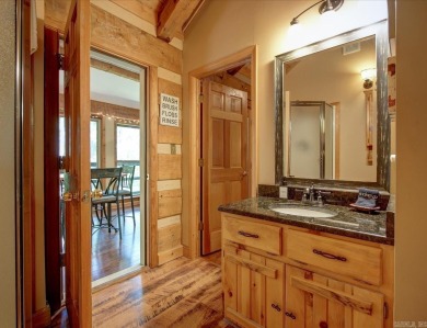Discover your peaceful forest retreat in this inviting 3-bedroom on Cortez Golf Course in Arkansas - for sale on GolfHomes.com, golf home, golf lot