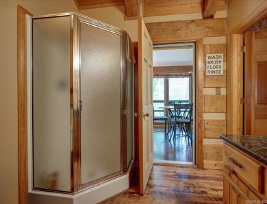 Discover your peaceful forest retreat in this inviting 3-bedroom on Cortez Golf Course in Arkansas - for sale on GolfHomes.com, golf home, golf lot