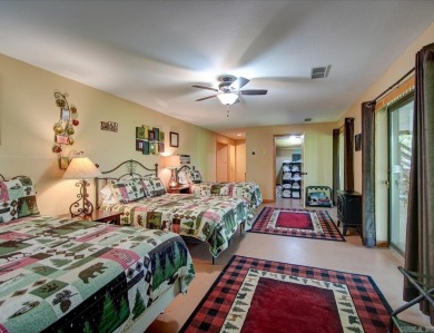 Discover your peaceful forest retreat in this inviting 3-bedroom on Cortez Golf Course in Arkansas - for sale on GolfHomes.com, golf home, golf lot