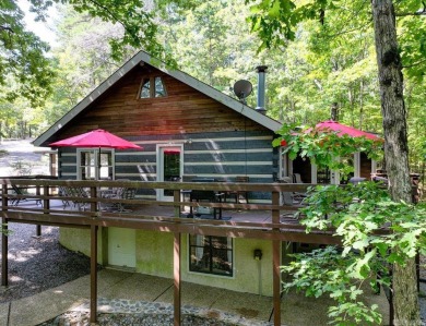 Discover your peaceful forest retreat in this inviting 3-bedroom on Cortez Golf Course in Arkansas - for sale on GolfHomes.com, golf home, golf lot