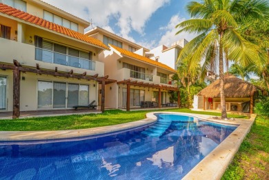 Experience luxury living in Puerto Aventuras with this beautiful on Club De Golf Puerto Aventuras in  - for sale on GolfHomes.com, golf home, golf lot