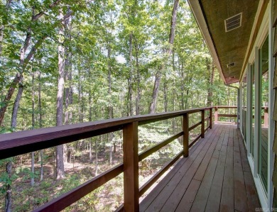 Discover your peaceful forest retreat in this inviting 3-bedroom on Cortez Golf Course in Arkansas - for sale on GolfHomes.com, golf home, golf lot
