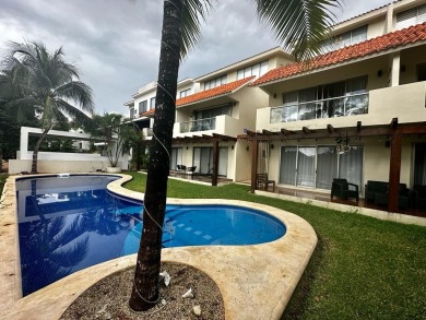 Experience luxury living in Puerto Aventuras with this beautiful on Club De Golf Puerto Aventuras in  - for sale on GolfHomes.com, golf home, golf lot