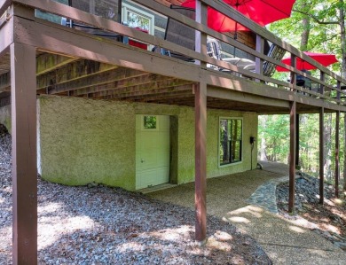 Discover your peaceful forest retreat in this inviting 3-bedroom on Cortez Golf Course in Arkansas - for sale on GolfHomes.com, golf home, golf lot