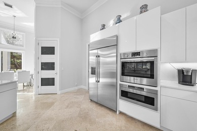 This airy custom built home sits on a half acre lot with on Old Marsh Golf Club in Florida - for sale on GolfHomes.com, golf home, golf lot