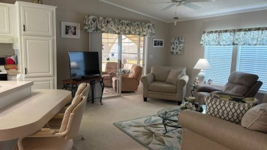 This quintessential Florida home is a perfect winter get-away or on Sabal Springs Golf and Racquet Club in Florida - for sale on GolfHomes.com, golf home, golf lot