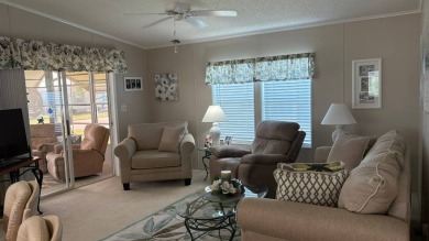 This quintessential Florida home is a perfect winter get-away or on Sabal Springs Golf and Racquet Club in Florida - for sale on GolfHomes.com, golf home, golf lot