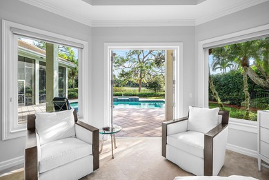 This airy custom built home sits on a half acre lot with on Old Marsh Golf Club in Florida - for sale on GolfHomes.com, golf home, golf lot