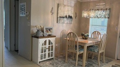 This quintessential Florida home is a perfect winter get-away or on Sabal Springs Golf and Racquet Club in Florida - for sale on GolfHomes.com, golf home, golf lot