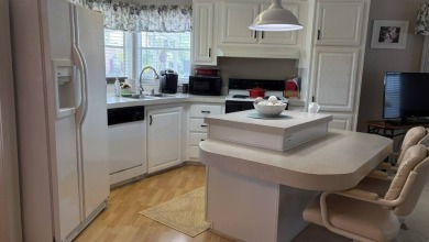 This quintessential Florida home is a perfect winter get-away or on Sabal Springs Golf and Racquet Club in Florida - for sale on GolfHomes.com, golf home, golf lot