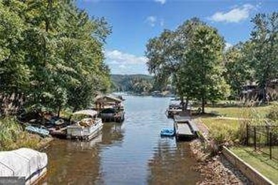 Lake Access and Private Dock! This Charming Lakeside Retreat is on The Highlands Course at Lake Arrowhead in Georgia - for sale on GolfHomes.com, golf home, golf lot