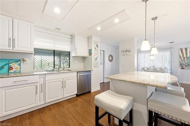 This polished home has updates throughout, a screened-in lanai on Riviera Golf Club in Florida - for sale on GolfHomes.com, golf home, golf lot