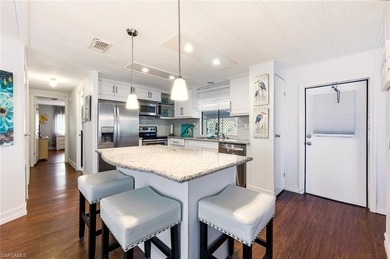 This polished home has updates throughout, a screened-in lanai on Riviera Golf Club in Florida - for sale on GolfHomes.com, golf home, golf lot