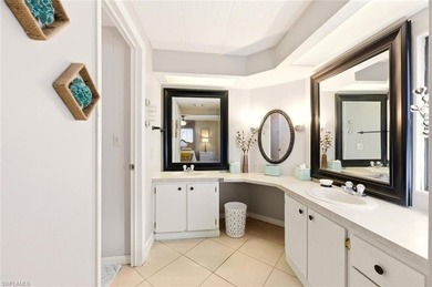 This polished home has updates throughout, a screened-in lanai on Riviera Golf Club in Florida - for sale on GolfHomes.com, golf home, golf lot