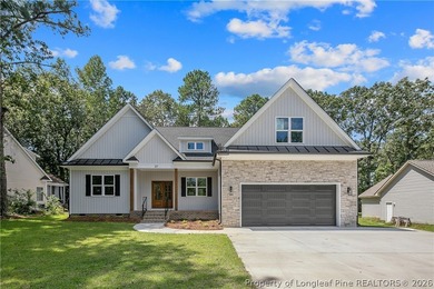 Welcome to this beautifully crafted 4 bedroom, 3 bath home on Carolina Lakes Country Club in North Carolina - for sale on GolfHomes.com, golf home, golf lot