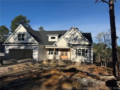 Welcome to this beautifully crafted 4 bedroom, 3 bath home on Carolina Lakes Country Club in North Carolina - for sale on GolfHomes.com, golf home, golf lot