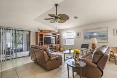 Beautiful CBC home backing to canal.  Magnificent landscaping on Spanish Lakes I in Florida - for sale on GolfHomes.com, golf home, golf lot