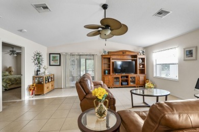 Beautiful CBC home backing to canal.  Magnificent landscaping on Spanish Lakes I in Florida - for sale on GolfHomes.com, golf home, golf lot