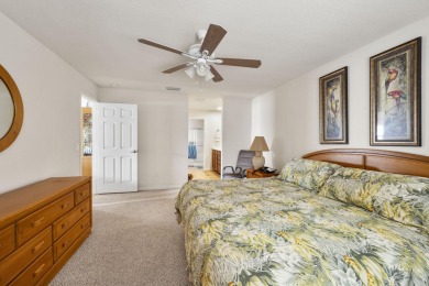 Beautiful CBC home backing to canal.  Magnificent landscaping on Spanish Lakes I in Florida - for sale on GolfHomes.com, golf home, golf lot