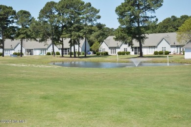 Enjoy the perfect combination of location and lifestyle in this on South Harbour Golf Links in North Carolina - for sale on GolfHomes.com, golf home, golf lot