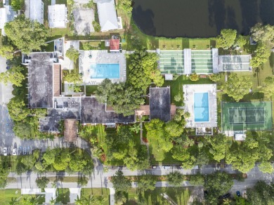 Beautiful CBC home backing to canal.  Magnificent landscaping on Spanish Lakes I in Florida - for sale on GolfHomes.com, golf home, golf lot