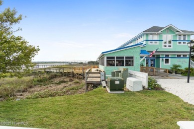 Enjoy the perfect combination of location and lifestyle in this on South Harbour Golf Links in North Carolina - for sale on GolfHomes.com, golf home, golf lot