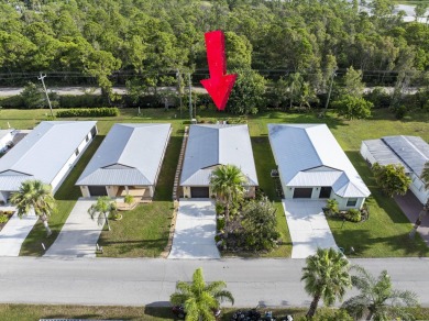Beautiful CBC home backing to canal.  Magnificent landscaping on Spanish Lakes I in Florida - for sale on GolfHomes.com, golf home, golf lot