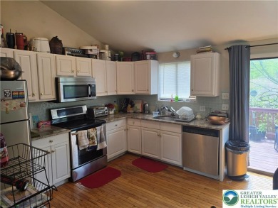 This 4 bedroom, 2 bath split level home sits in an amenity on Pocono Farms Country Club in Pennsylvania - for sale on GolfHomes.com, golf home, golf lot