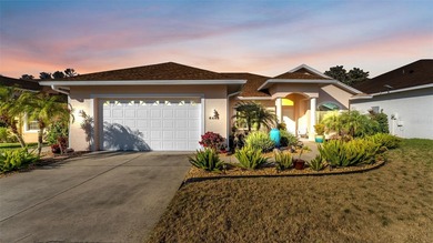 Spend your days under swaying palm trees as you chip, putt and on Huntington Hills Golf and Country Club in Florida - for sale on GolfHomes.com, golf home, golf lot