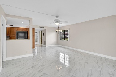 Amazing 2/2 deluxe corner condo with direct lake and golf course on Kings Point Golf -Flanders Way in Florida - for sale on GolfHomes.com, golf home, golf lot