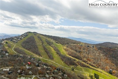 Come build your dream mountain retreat! This gentle sloping on Beech Mountain Club in North Carolina - for sale on GolfHomes.com, golf home, golf lot