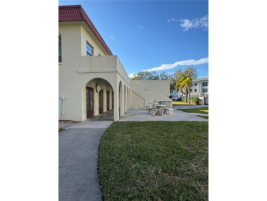 Mediterranean Manors, located at Dunedin is a water front on The Dunedin Country Club in Florida - for sale on GolfHomes.com, golf home, golf lot