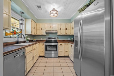 Peaceful waterfront views abound from each room in this updated on DeSoto Golf Course in Arkansas - for sale on GolfHomes.com, golf home, golf lot