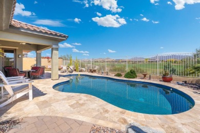 This stunning oasis is located on the 16th hole in Estrella's on Estrella Mountain Ranch Golf Course in Arizona - for sale on GolfHomes.com, golf home, golf lot