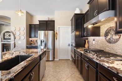 This stunning oasis is located on the 16th hole in Estrella's on Estrella Mountain Ranch Golf Course in Arizona - for sale on GolfHomes.com, golf home, golf lot