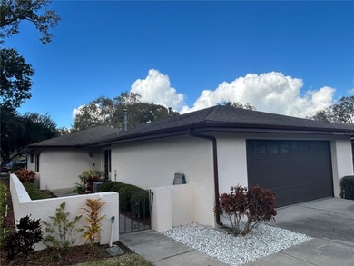 MOVE IN CONDITION!  Nestled on a beautifully landscaped and tree on Cypresswood Golf and Country Club in Florida - for sale on GolfHomes.com, golf home, golf lot