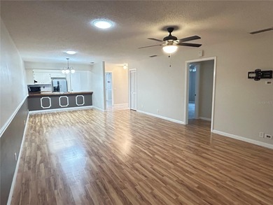 MOVE IN CONDITION!  Nestled on a beautifully landscaped and tree on Cypresswood Golf and Country Club in Florida - for sale on GolfHomes.com, golf home, golf lot