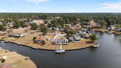 Spectacular water views from nearly every room make this home on Harbour Point Golf Club in North Carolina - for sale on GolfHomes.com, golf home, golf lot