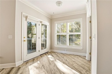 This beautifully updated first-floor, end-unit condominium on The King and Prince Golf Course, Home of the Hampton Club in Georgia - for sale on GolfHomes.com, golf home, golf lot