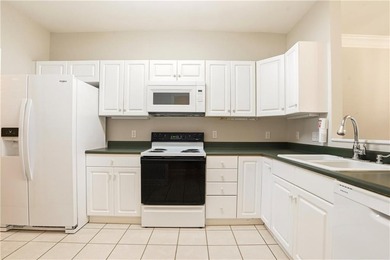 This beautifully updated first-floor, end-unit condominium on The King and Prince Golf Course, Home of the Hampton Club in Georgia - for sale on GolfHomes.com, golf home, golf lot