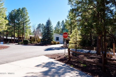 Tucked among towering pines, this inviting cabin offers the calm on Torreon Golf Club in Arizona - for sale on GolfHomes.com, golf home, golf lot