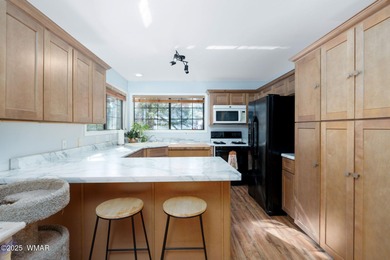 Tucked among towering pines, this inviting cabin offers the calm on Torreon Golf Club in Arizona - for sale on GolfHomes.com, golf home, golf lot