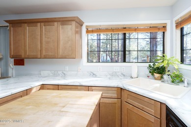 Tucked among towering pines, this inviting cabin offers the calm on Torreon Golf Club in Arizona - for sale on GolfHomes.com, golf home, golf lot