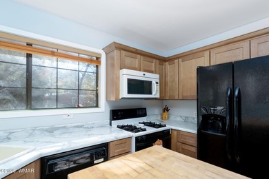 Tucked among towering pines, this inviting cabin offers the calm on Torreon Golf Club in Arizona - for sale on GolfHomes.com, golf home, golf lot